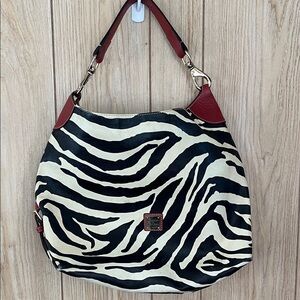 Dooney and Bourke. Stylish Zebra Print Shoulder Bag with Red Accents